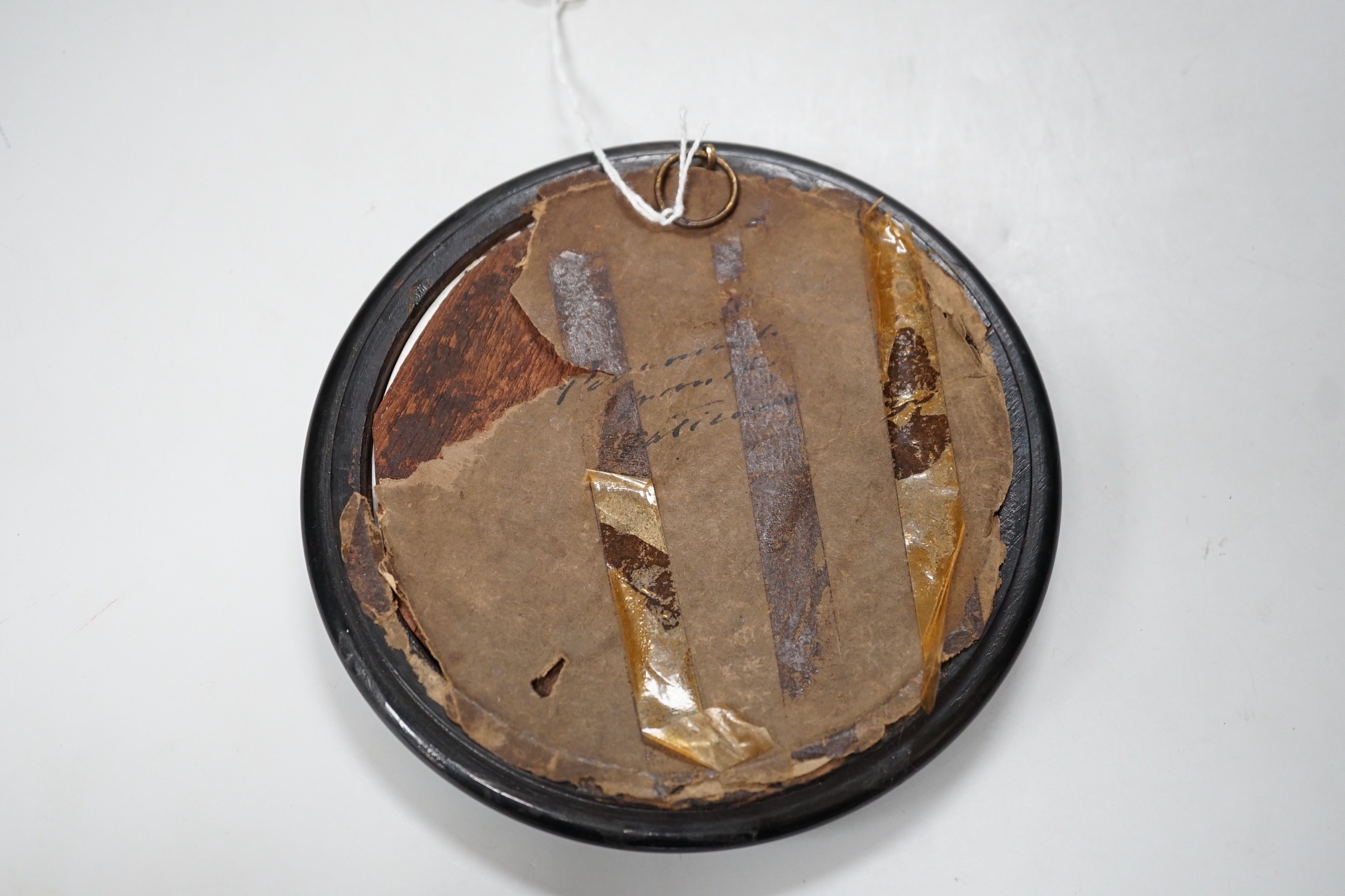 A 19th century Continental porcelain plaque. 16cm diameter overall